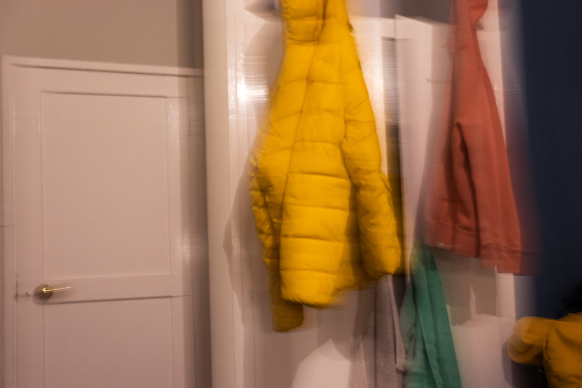 yellow textile on white wooden door