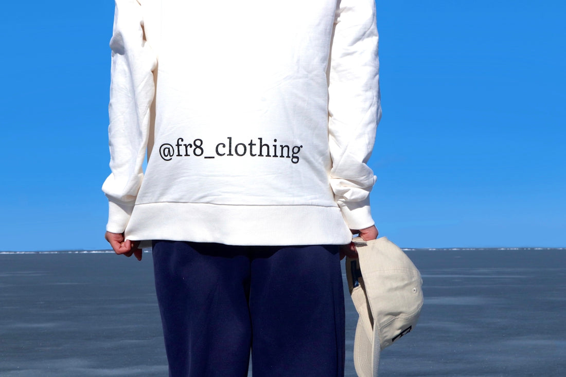 the back of a person wearing a white sweatshirt with the words off8 clothing on
