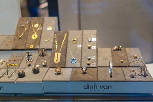 Dinh van paris jewelry display with necklaces and rings