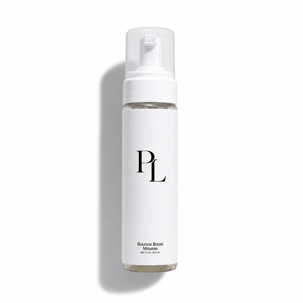 Minimalistic mousse bottle on white backdrop
