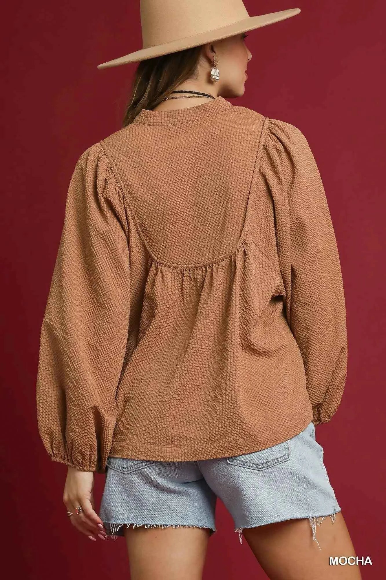 Umgee Textured Notched Blouse with Balloon Sleeves 01fc8fb0-7d74-4168-8ed6-e99b5de6a2cb-Max-Origin