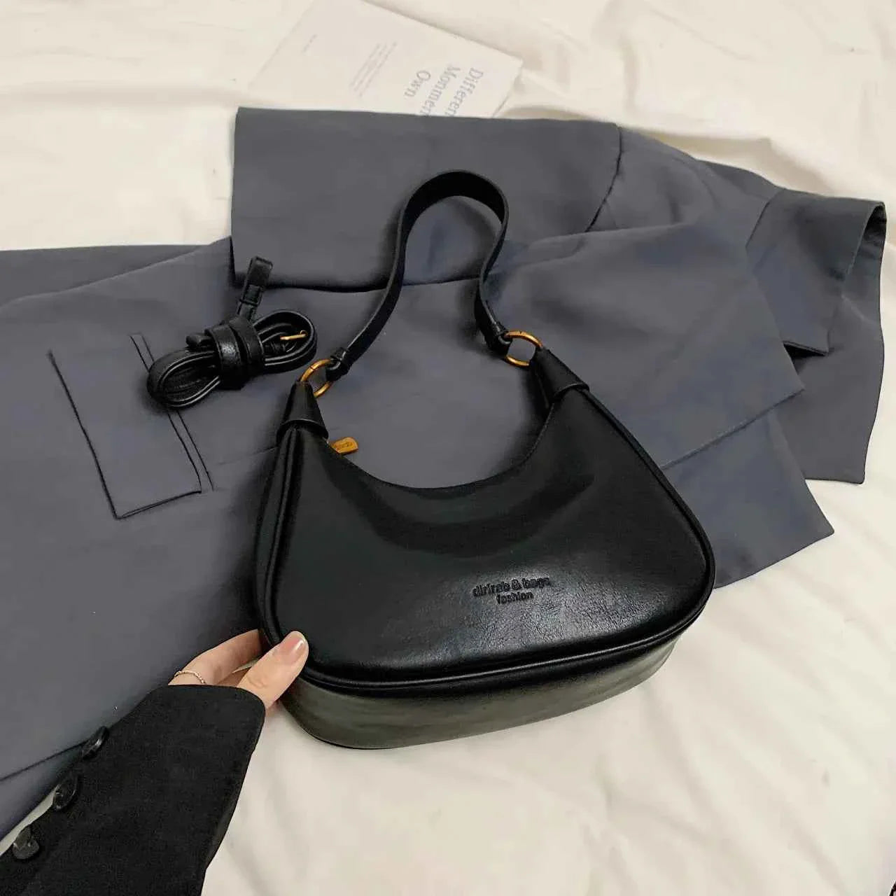 Curved Leather Shoulder Bag Black onesize 0786365dd662429fb5151d23a73d3a7c-Max-Origin