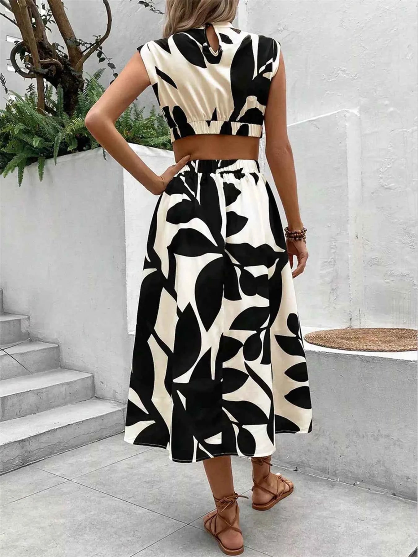 Cutout Printed Sleeveless Dress 08c130ac-2da7-4b61-ac03-0a8a28492df6-Max-Origin