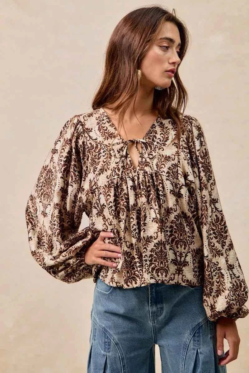 BiBi Printed Woven Front Tied Blouse with Baloon Sleeve 0be001dd918f4f91a8745ba03e555e6d-Max-Origin