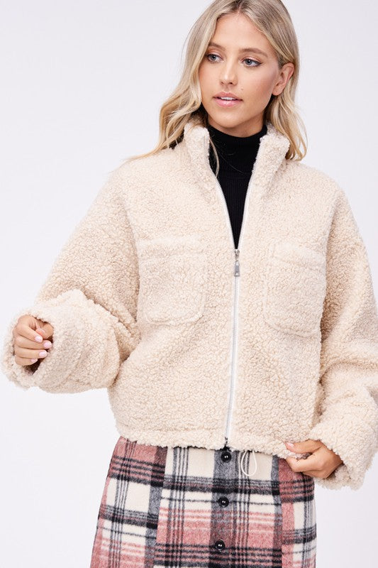 Sherpa jacket with front pockets 12779490_e46e1dd5-5971-4cd7-9c3a-1ea9a3c69dd3