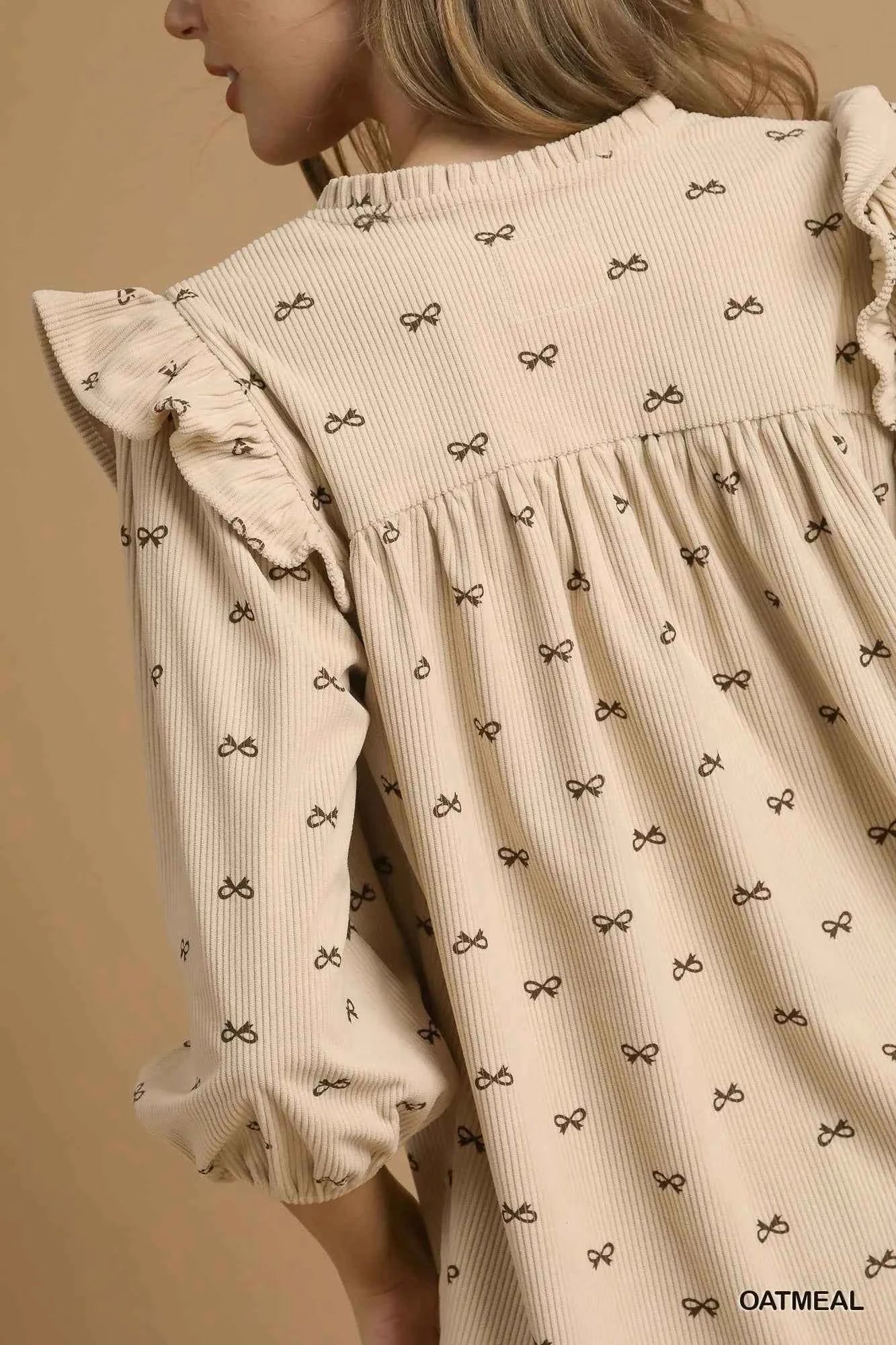 Umgee Bow Print Corduroy Puff Sleeve Blouse with Ruffled 172e5061-21d8-45d3-b3db-1a1415698de3-Max-Origin