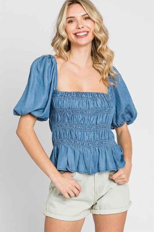 Denim Smocked Peplum Top Denim Blue 18428472_4ff21bde-f22d-4d82-8aea-2fa4c2e5824f