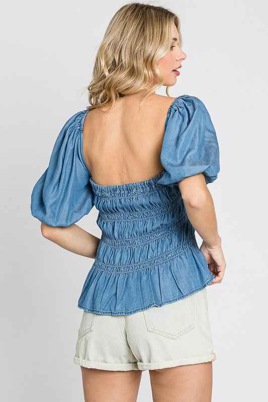 Denim Smocked Peplum Top 18428472_67f0a2e5-9220-4168-8a43-f90c45eddf88