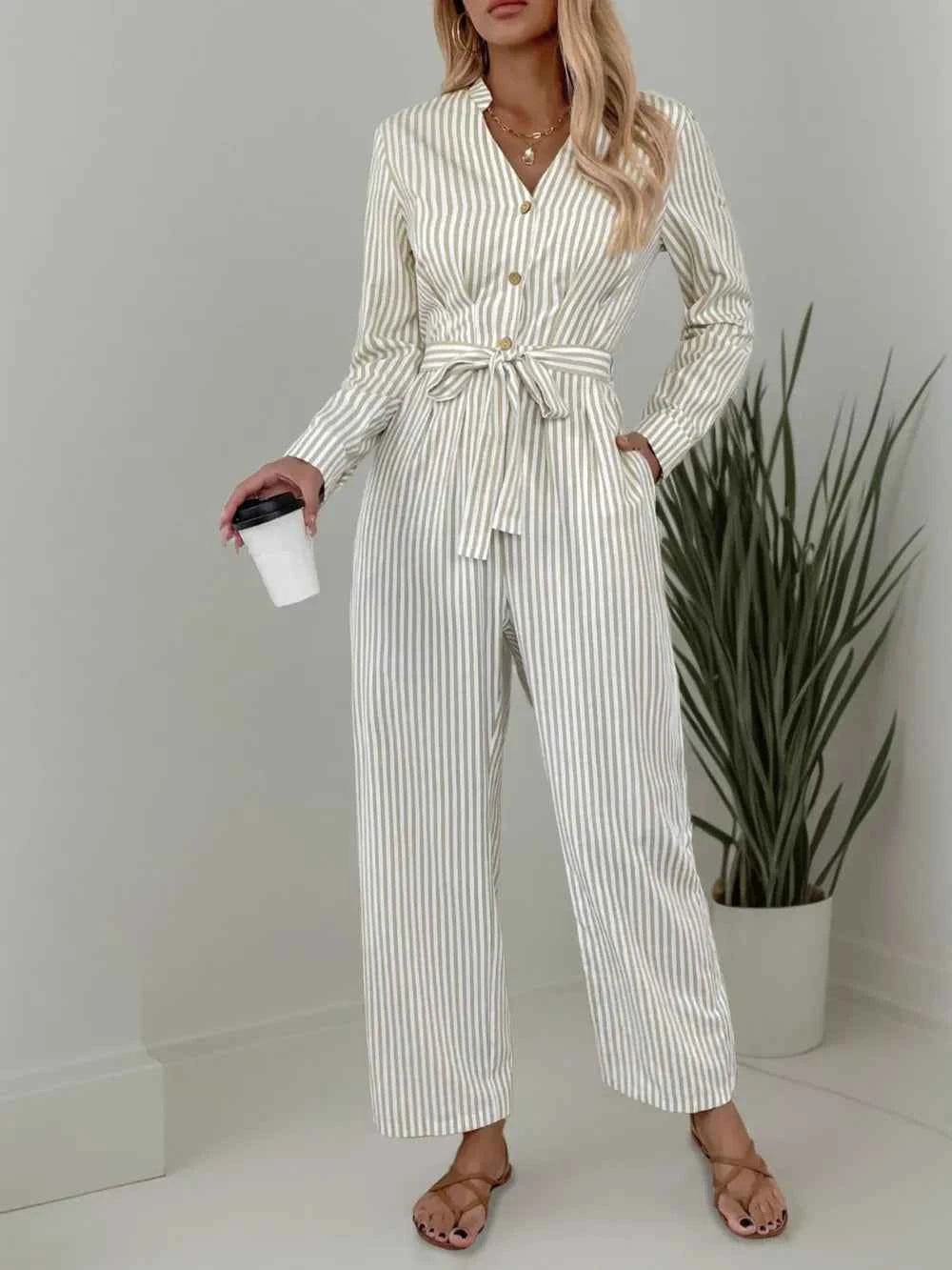 Striped Notched Long Sleeve Tie Waist Jumpsuit 24338873-163b-44c4-b016-11eadc6e802d-Max