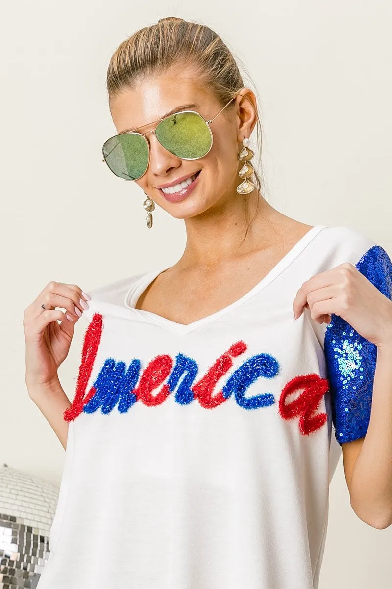 BiBi Metallic Letter V-neck Sequin Sleeves Top 26e860b90766425aadb8a61019d918e9-Max-Origin