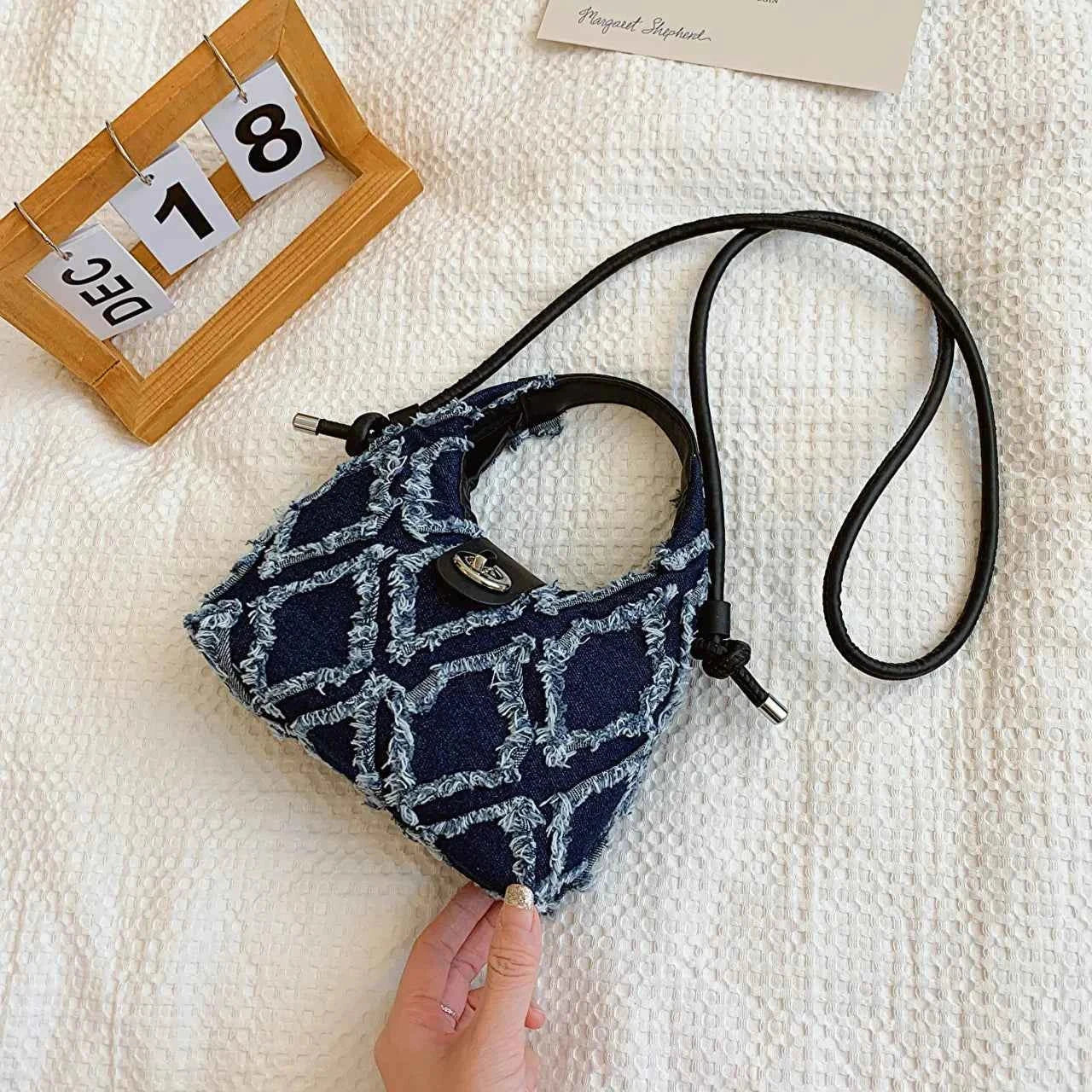 Quilted Raw Hem Mini Crossbody Bag 27172789e56546d38b714c7a5b513d51-Max-Origin