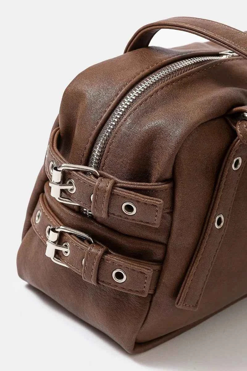 Fame Multi Grommet Belt Strap Rustic Rectangular Hand Bag 586477d0f8774a01ba6e1d487c95c423-Max-Origin
