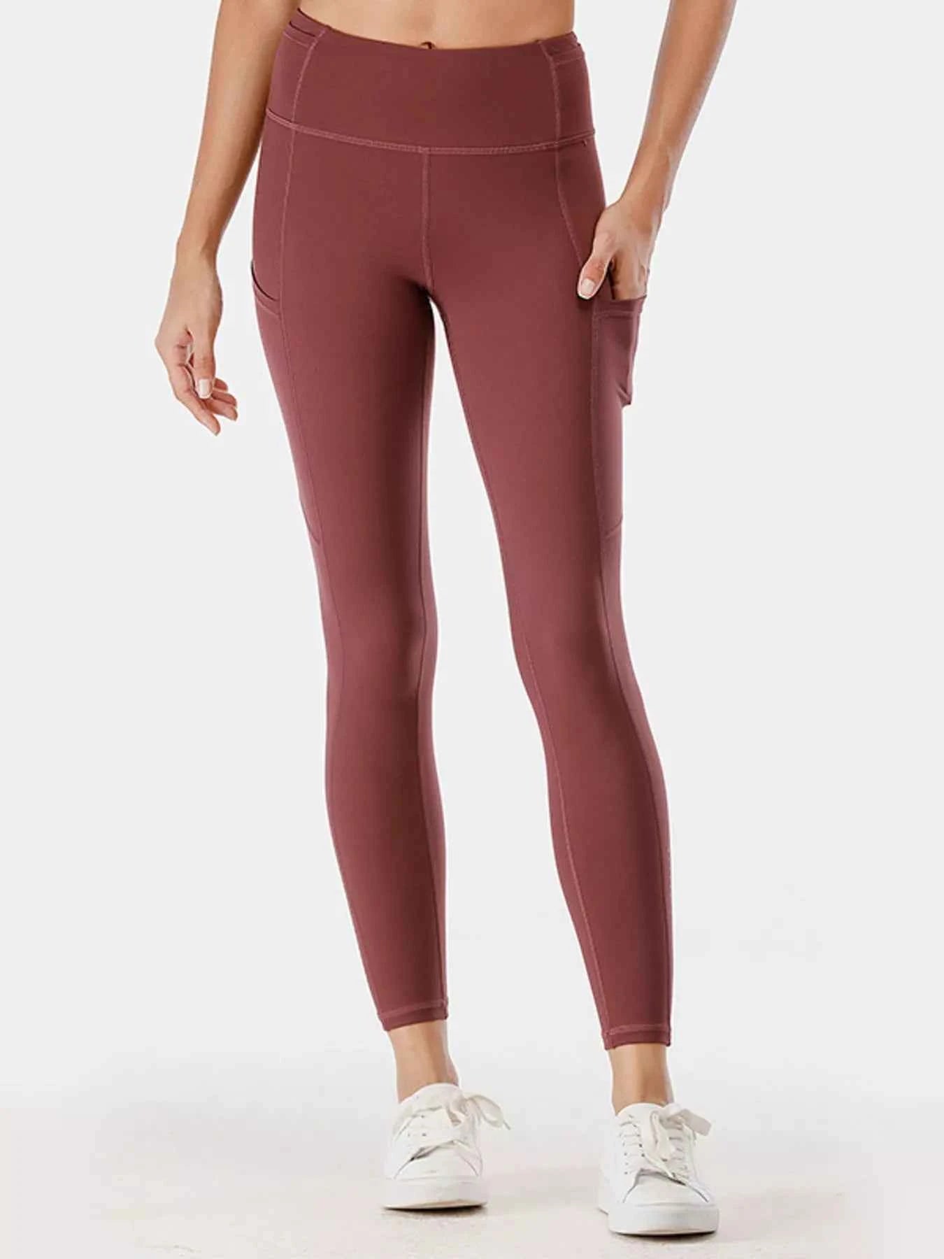 Full Size High-Waisted Active Leggings with Pockets Plus Size Rust 596026005ac44ff6a12a1640aa7412ae-Max-Origin