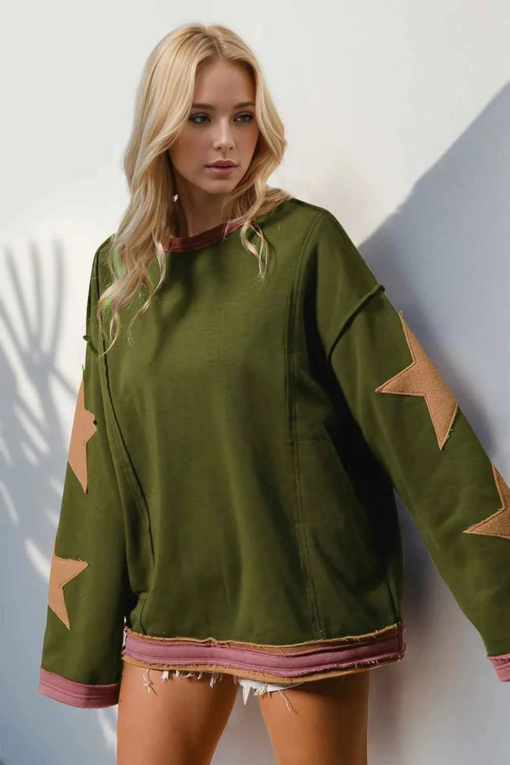 Double Take Star Patched Long Sleeve Sweatshirt 5a4bd55e-6beb-4d82-bafe-ae436bdd2604-Max