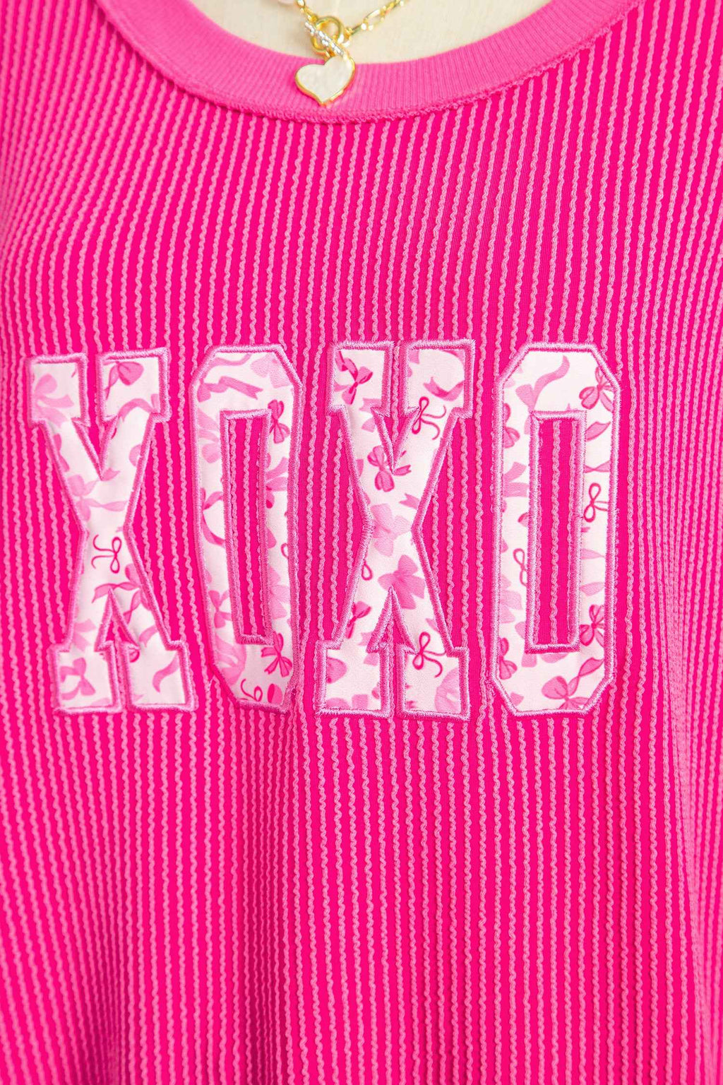Strawberry Pink Twisted Ribbed Long Sleeve XOXO Bow Print Embroidered Patch Graphic Top 6434f7e6b32fa62d