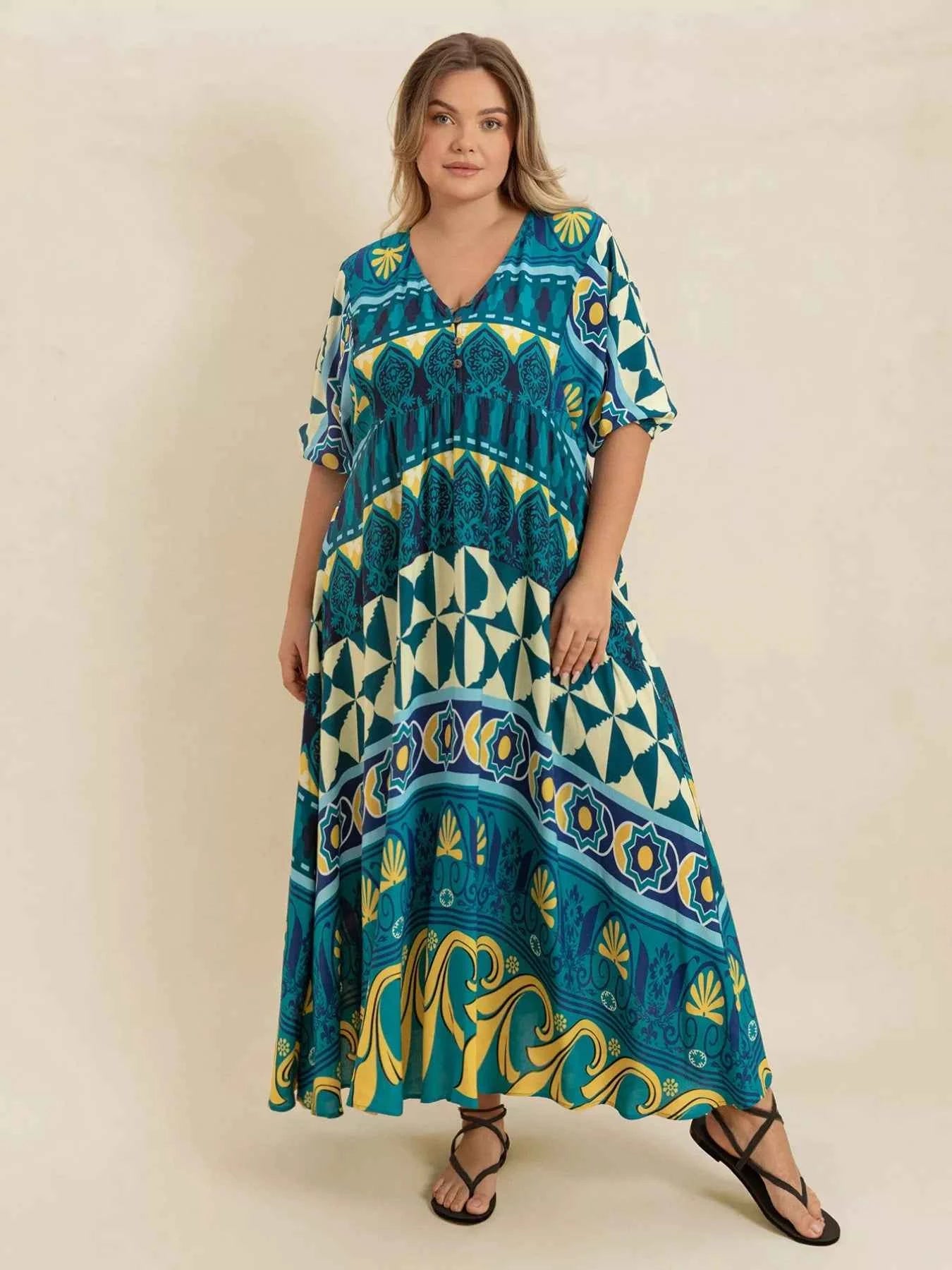 Plus Size Printed V-Neck Half Sleeve Midi Dress 6781c773-1607-46e9-8033-f4ef029d5e52-Max-Origin