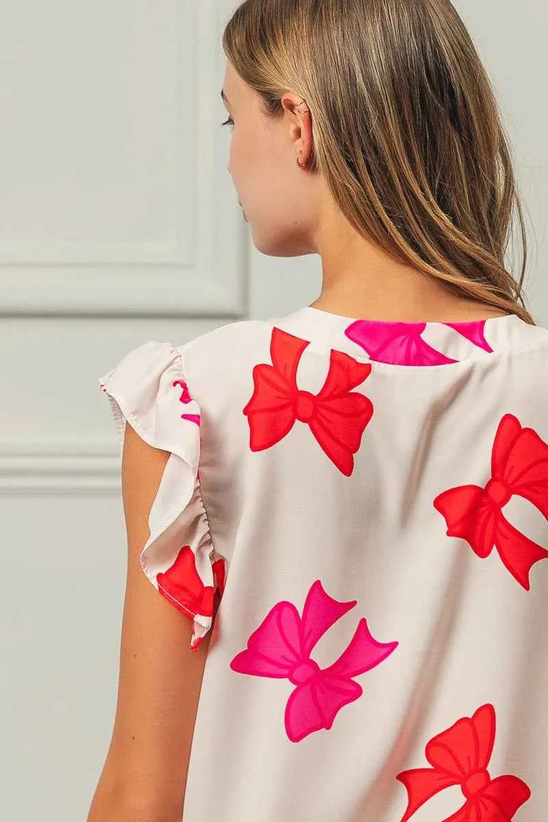 BiBi Bow Printed Woven Ruffled Sleeves V Neck Top 6b7f784d4c1f4ec3a566baf5a5cd85a1-Max-Origin