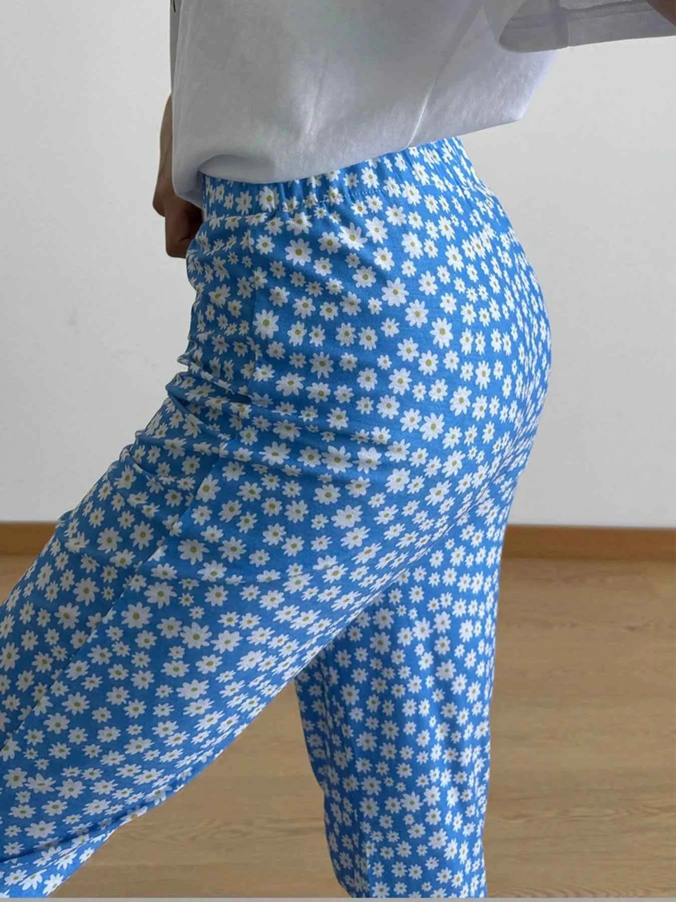 Floral Print Flare Leg Pants 761228fe-a88a-4a62-bf35-151f12c12034-Max-Origin