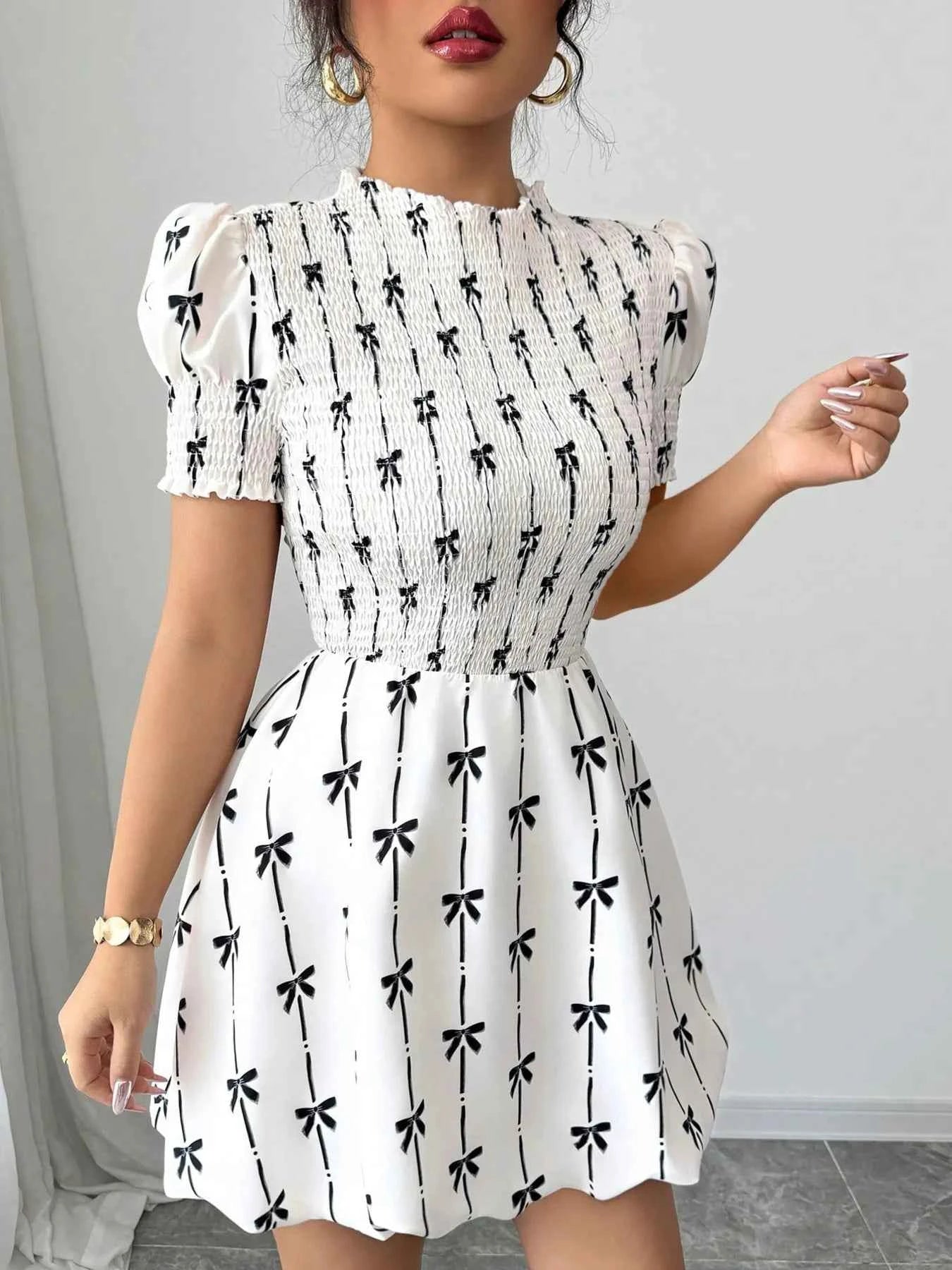 Smocked Bow Print Short Sleeve Dress 773f4534c65545d2bac477d2b1e5c4e7-Max-Origin