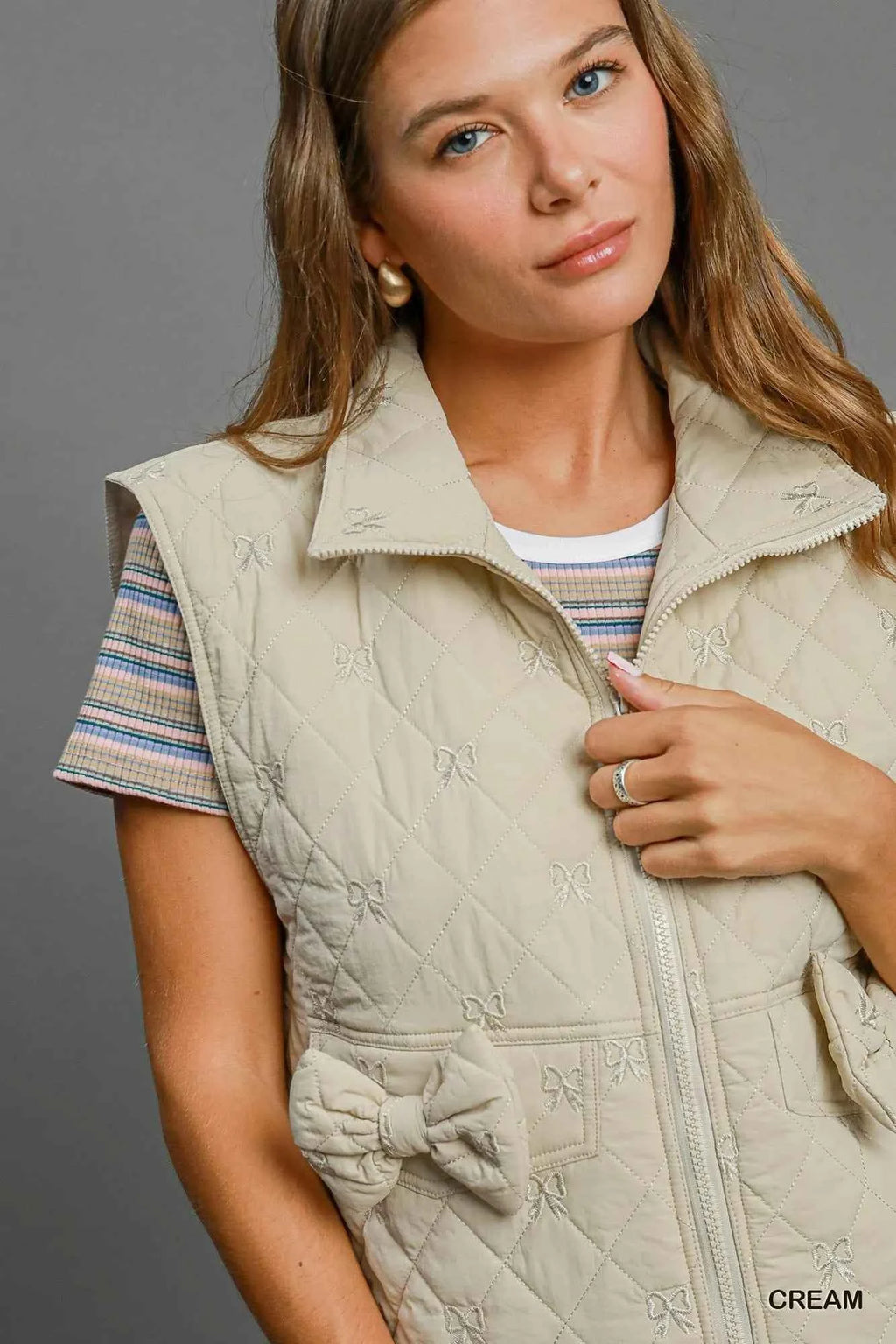 Umgee Sleeveless Quilted Vest with Bow Details 7e5cc864-80d5-45ba-a7a4-8b367036592c-Max-Origin