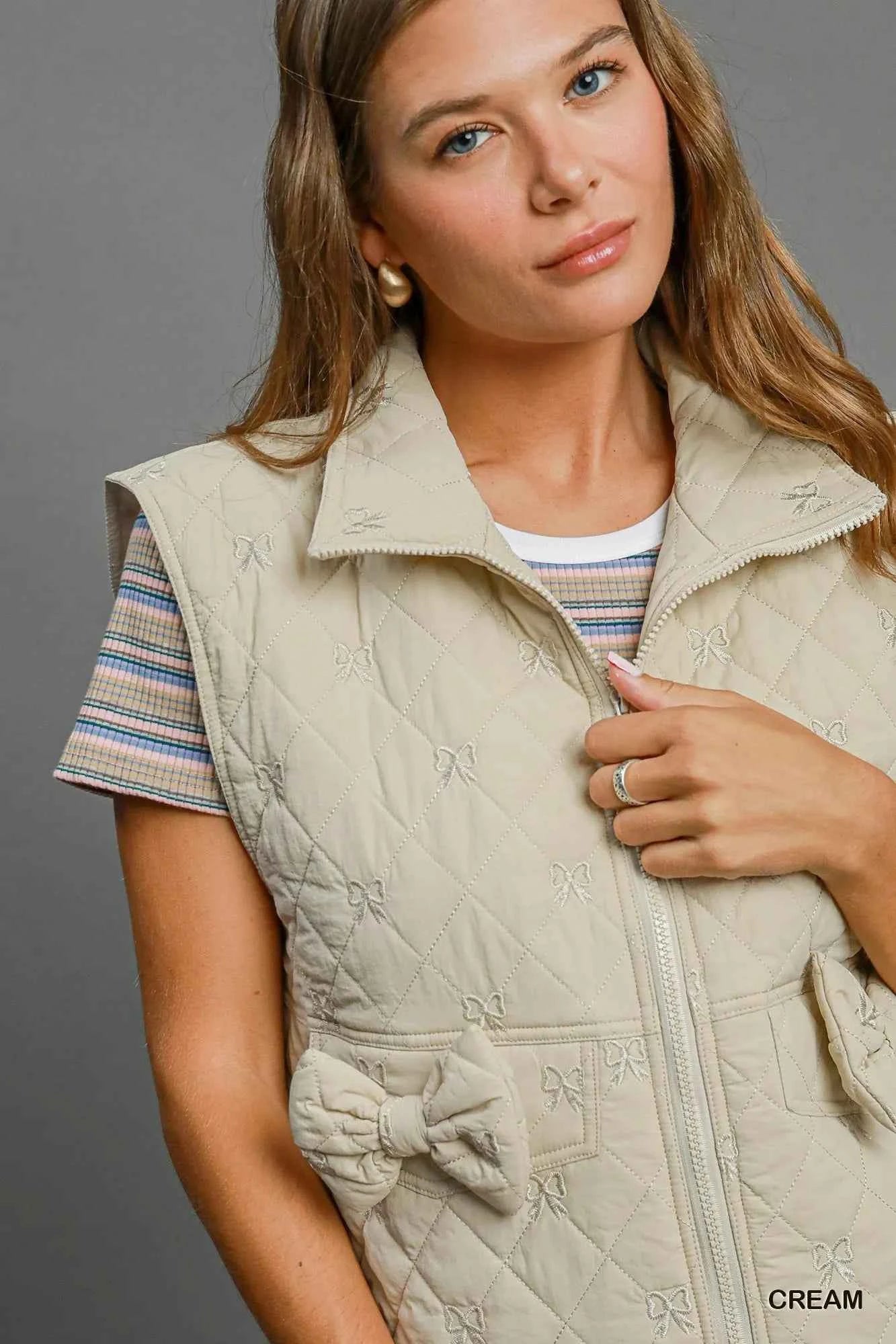 Umgee Sleeveless Quilted Vest with Bow Details 7e5cc864-80d5-45ba-a7a4-8b367036592c-Max-Origin
