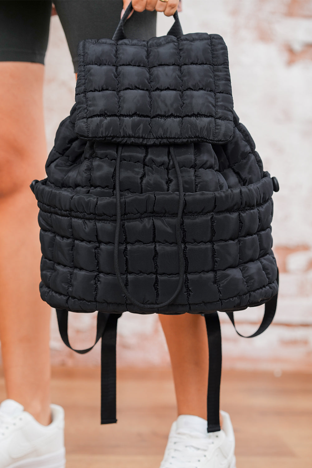 Black Solid Flapped Quilted Puffer Backpack 807e86d8451fb4fa