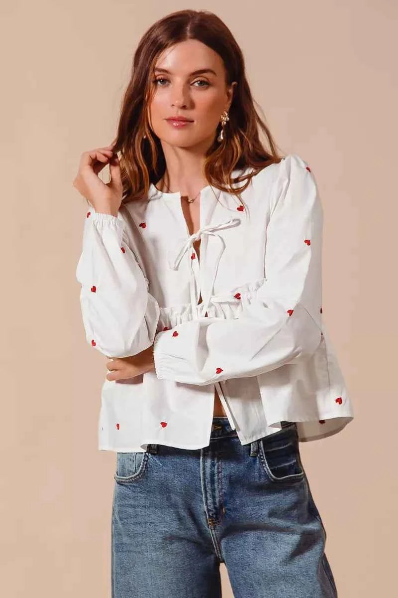 SO ME Front Tie Heart Embroidered Blouse With Puff Sleeve 85a13a0f404a4ea38d9c9f70f57bc8fc-Max-Origin