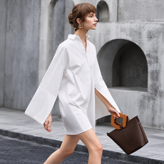 The Relaxed Single-Breasted Shirt Dress BrutalistArchesandSculpturalHandbag