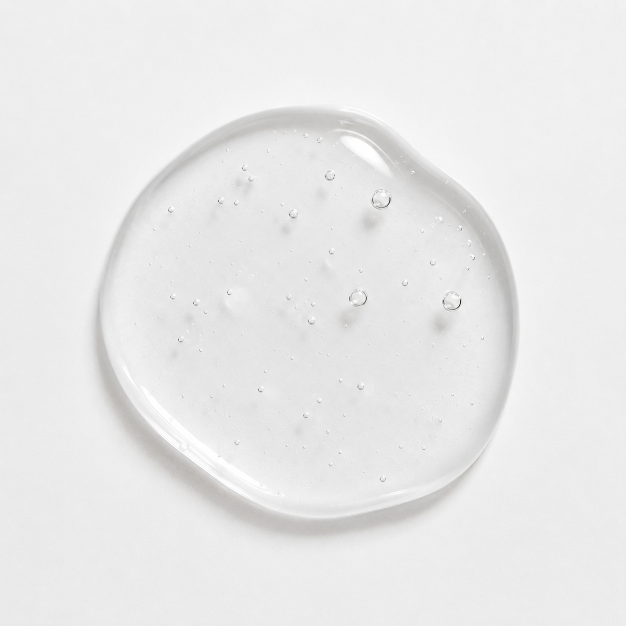 Hyaluronic Acid Serum | Deep Hydration & Plumping Formula Clear_gel_droplet_on_smooth_surface