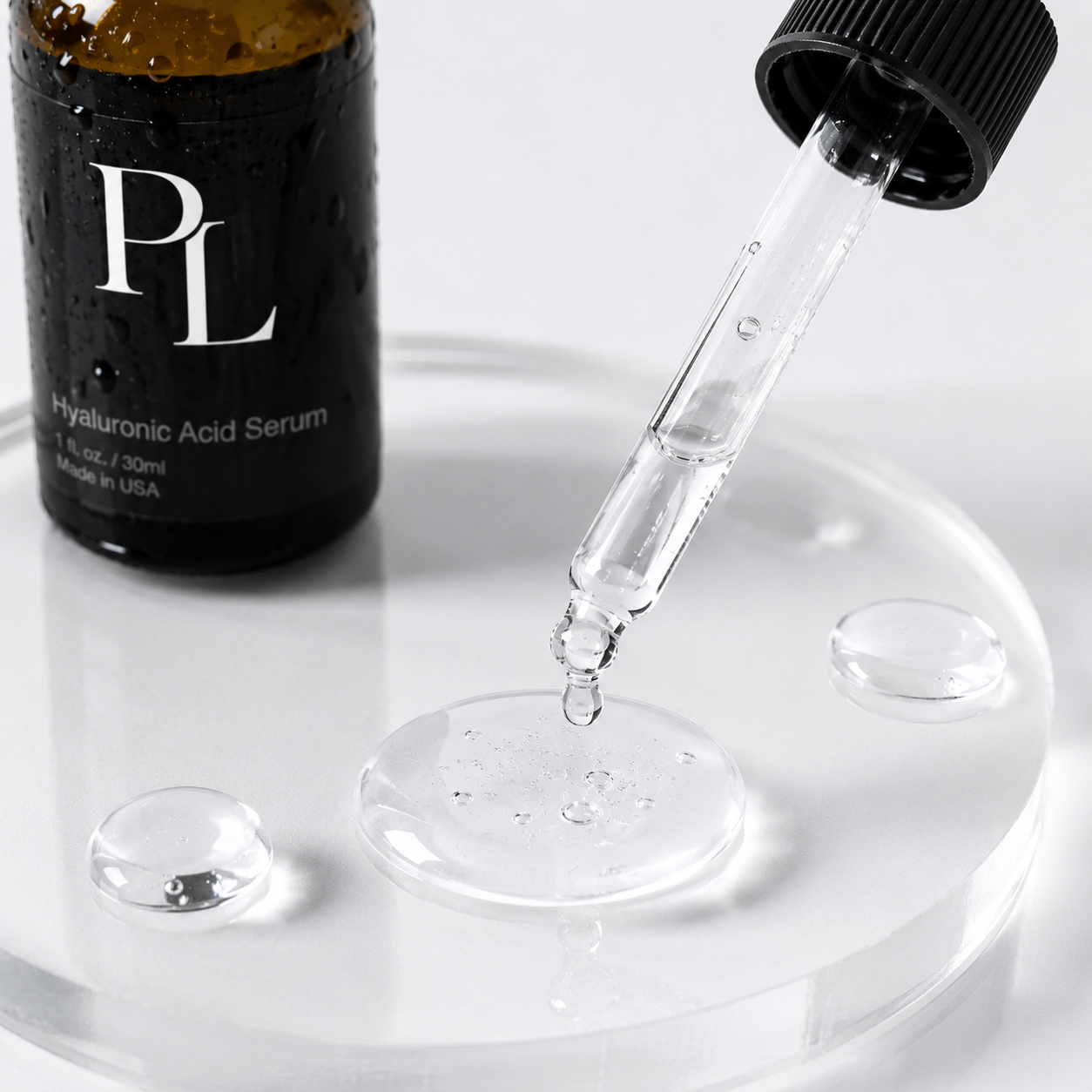 Hyaluronic acid serum bottle with dropper on a white surface
