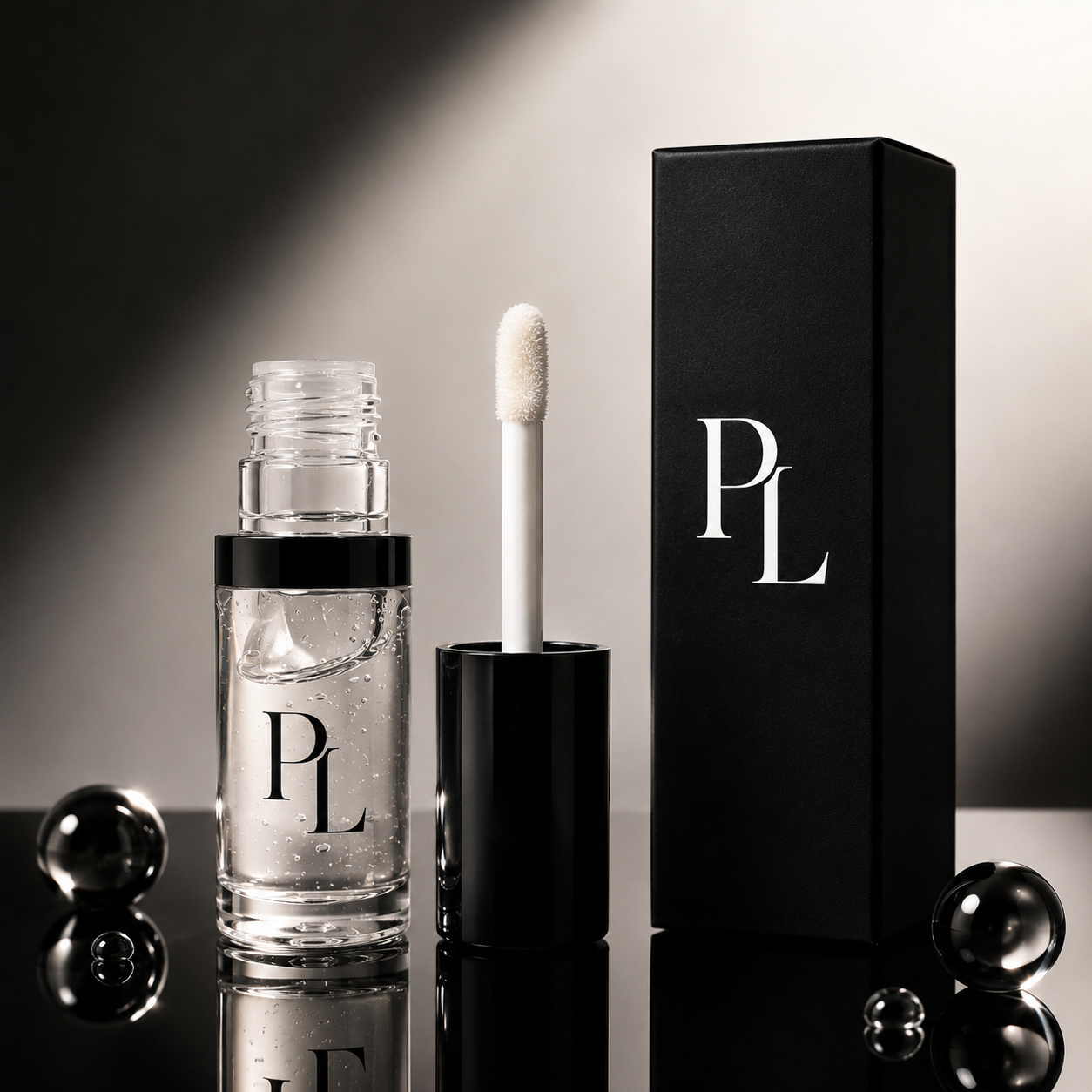 Makeup product with applicator and black box featuring 'PL' logo on a reflective surface.