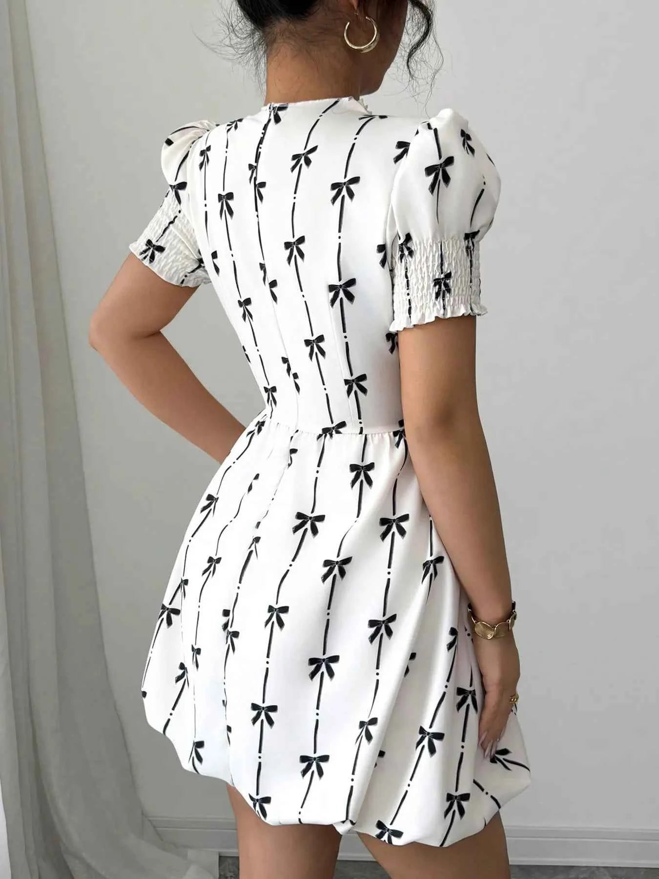 Smocked Bow Print Short Sleeve Dress a08f5fb855f24fd9abe71b472d701a17-Max-Origin