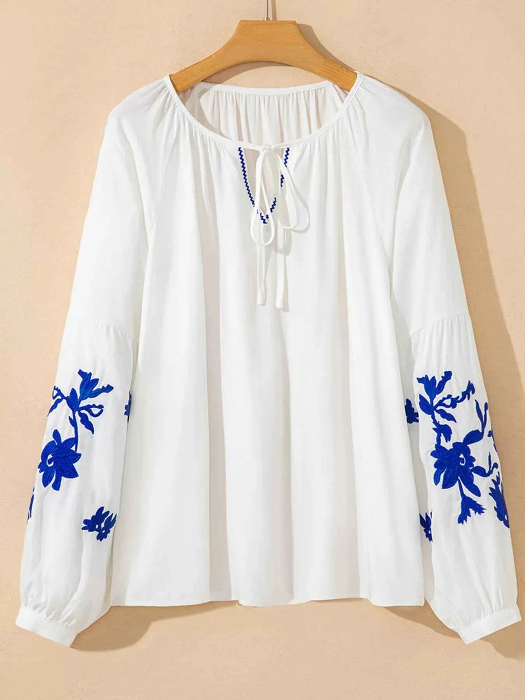 Floral Embroidered Tie Neck Blouse b6c6f5ee07414ddaa26b679249a3617b-Max-Origin