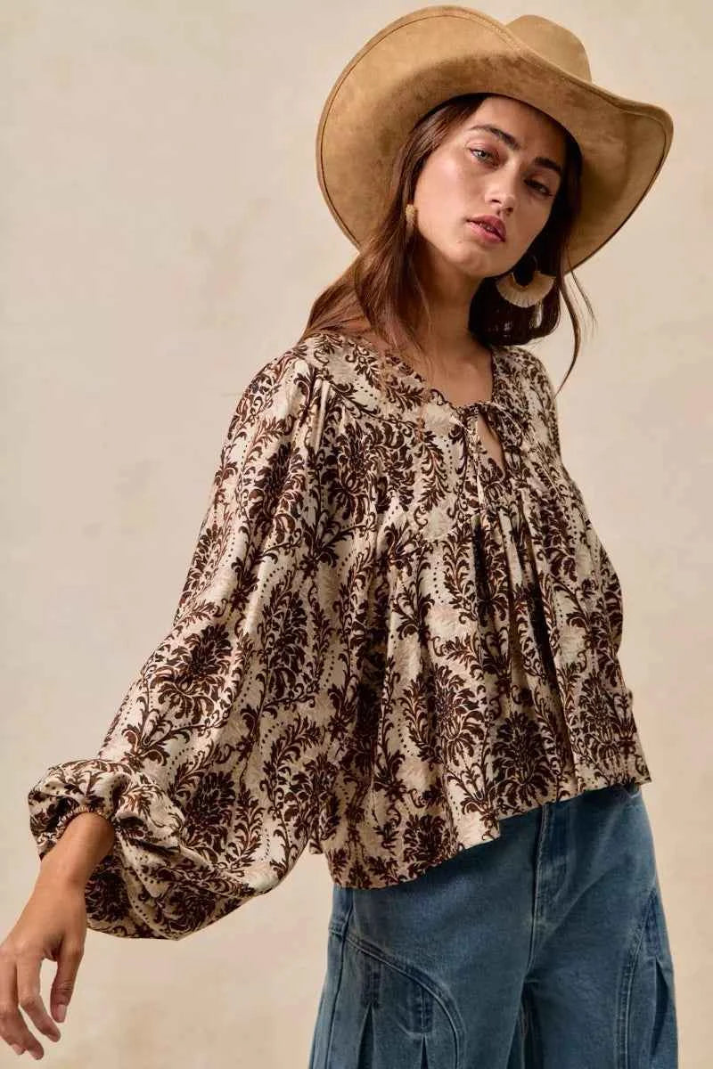 BiBi Printed Woven Front Tied Blouse with Baloon Sleeve c0ce5b63a14c489f9466b54a1e1dcd37-Max-Origin