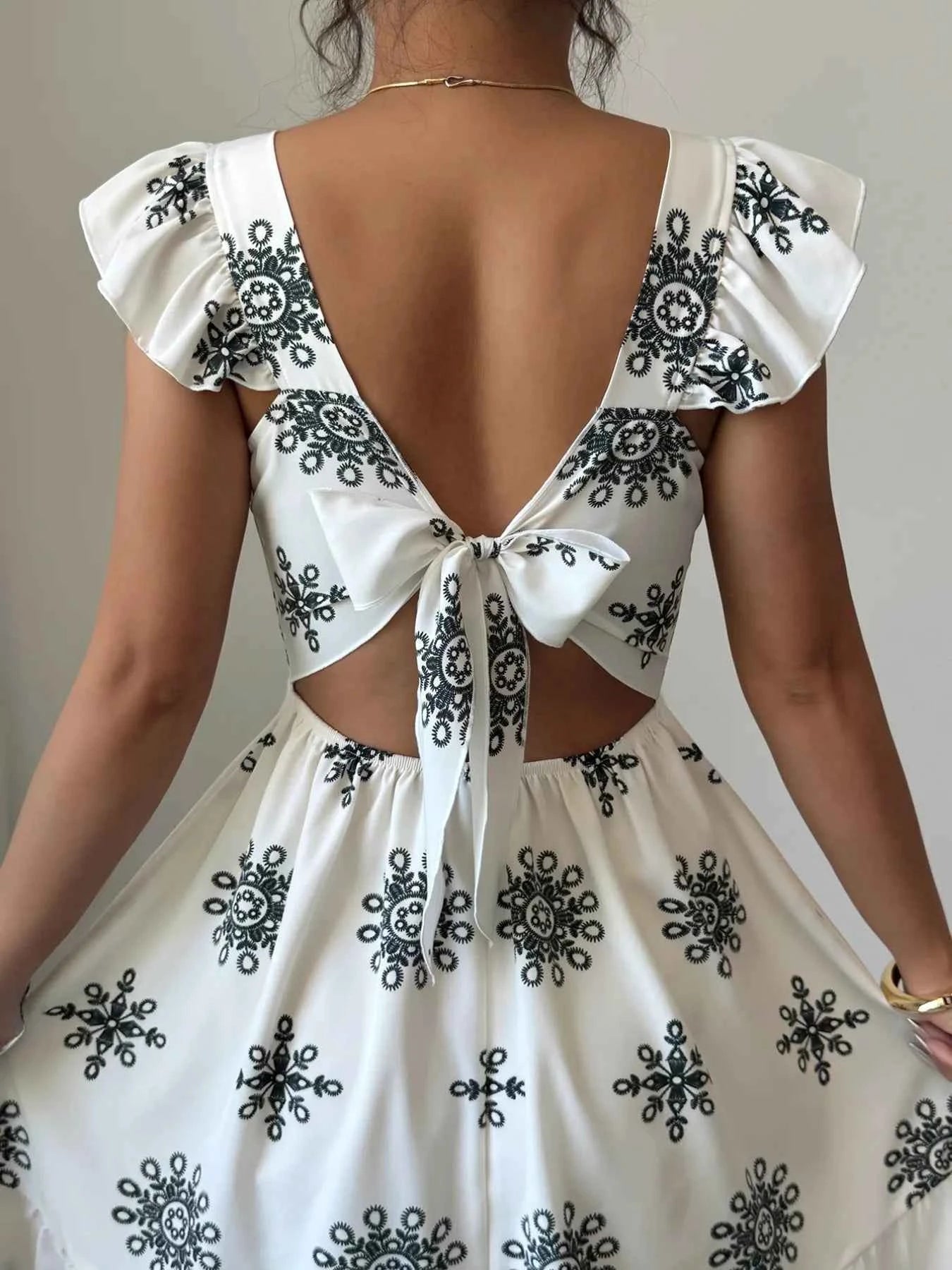 Printed Ruffled Cap Sleeve Dress cfa89677-1424-4282-9ec0-9a8cece365a4-Max-Origin