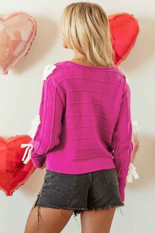 Bow Cut-Out Round Neck Sweater d3a3e5cd-34fc-49e2-8982-10e9365f8a3d