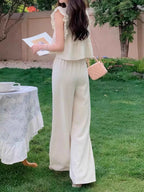 Ruffled Sleeveless Top and Wide Leg Pants Set dc132c1b-6afe-41c3-829b-bf040feb536f-Max-Origin