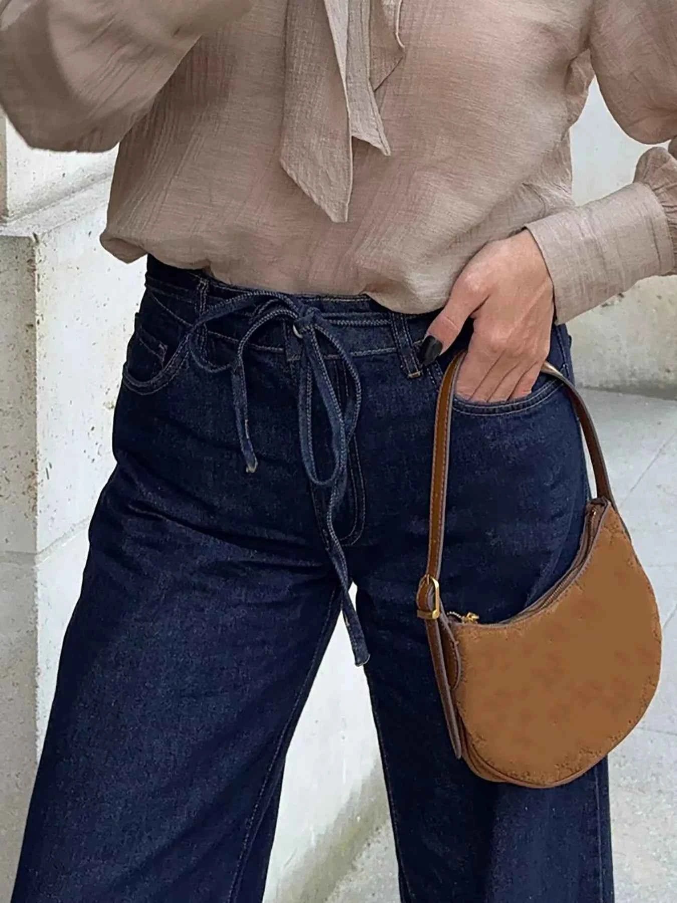 Tied Loose Fit Flare Jeans dc463cce76314464a724c57bb5427d96-Max-Origin