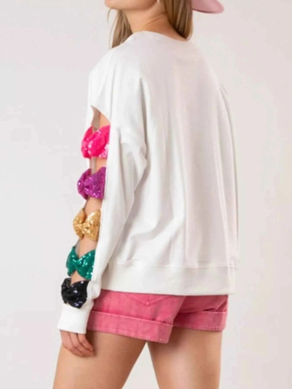 Sequin Bow Cutout Round Neck Sweatshirt f8643b67-7ed9-4865-b657-399397389c7e-Max-Origin