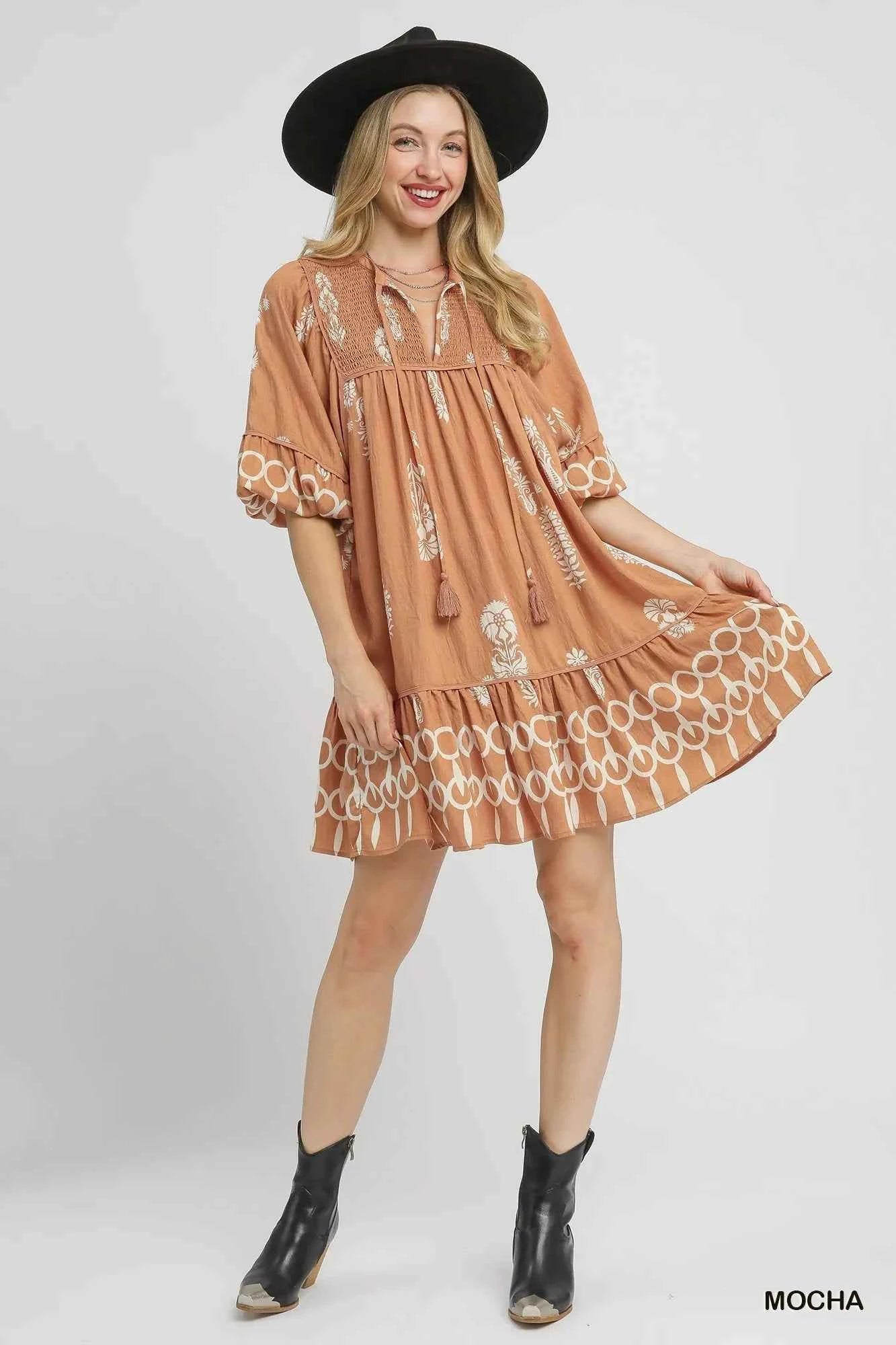 Umgee Boarder Print Tassel Tie Neck Mini Dress fbcaa1d1-73a7-4351-9f6f-50b8a939261e-Max-Origin
